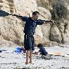 Matthew McConaughey soaks up the Southern California sun playing with his dogs and exercising along Malibu beach.