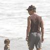 Matthew McConaughey plays with his son, Levi, on a beach in MalibuLos Angeles.