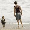 Matthew McConaughey plays with his son, Levi, on a beach in MalibuLos Angeles.