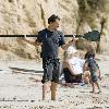 Matthew McConaughey soaks up the Southern California sun playing with his dogs and exercising along Malibu beach.