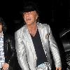 Mickey Rourke leaving Jalouse weaing a silver suit and blue suede shoes London.