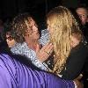 Mickey Rourke leaving Mahiki nightclub with a mystery blonde.