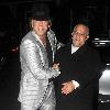 Mickey Rourke leaving Jalouse weaing a silver suit and blue suede shoes London.