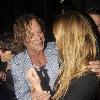 Mickey Rourke leaving Mahiki nightclub with a mystery blonde.