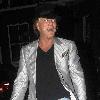 Mickey Rourke leaving Jalouse weaing a silver suit and blue suede shoes London.