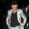 Mickey Rourke leaving Jalouse weaing a silver suit and blue suede shoes London.