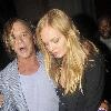 Mickey Rourke leaving Mahiki nightclub with a mystery blonde.