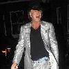 Mickey Rourke leaving Jalouse weaing a silver suit and blue suede shoes London.