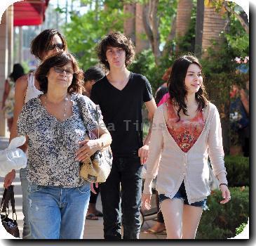 Miranda Cosgrove shopping in Hollywood with her friends and familyCalifornia.