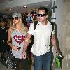 Paris Hilton, wearing a t-shirt with her name on it, arriving at LAX with her boyfriend Doug Reinhardt to catch a flight to Germany Los Angeles.