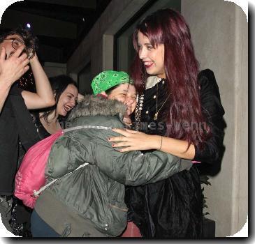 Peaches Geldof in a fit of giggles as she is hugged by a fan as she returns to her London Hotel London.