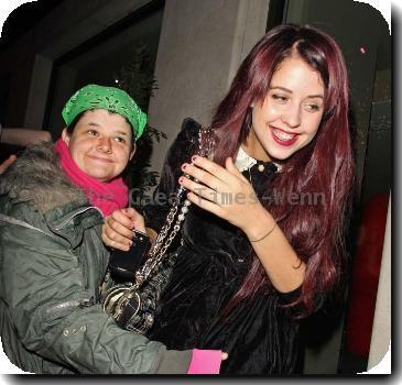 Peaches Geldof in a fit of giggles as she is hugged by a fan as she returns to her London Hotel London.