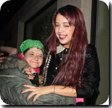 Peaches Geldof in a fit of giggles as she is hugged by a fan as she returns to her London Hotel London.