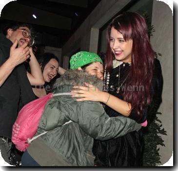 Peaches Geldof in a fit of giggles as she is hugged by a fan as she returns to her London Hotel London.