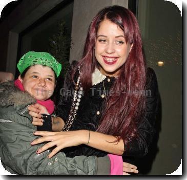 Peaches Geldof in a fit of giggles as she is hugged by a fan as she returns to her London Hotel London.