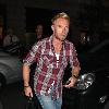 Ronan Keating arrives at his hotel looking more like a plumber wearing a checked shirt, ripped jeans and boots London.