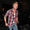 Ronan Keating arrives at his hotel looking more like a plumber wearing a checked shirt, ripped jeans and boots London.