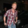 Ronan Keating arrives at his hotel looking more like a plumber wearing a checked shirt, ripped jeans and boots London.