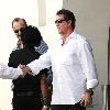 Arnold Schwarzenegger leaving Le Grand Passage restaurant after having lunch with fellow actor Sylvester Stallone..