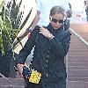 Abbie Cornish 
leaving a store after buying camera equipment.