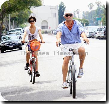 Billy Zane and his girlfriend ride bicycles in Beverly HillsLos Angeles.