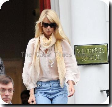 Claudia Schiffer 
makes her way home after taking her children to school.