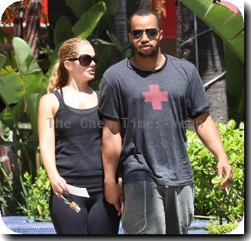 **Exclusive**Donald Faison and Cacee Cobb holding hands while out walking in West HollywoodLos Angeles.