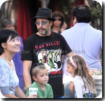 Judd Nelson wearing a t-shirt with 'Iin Love We Trust - See Below - If You Can't Hear Your Mind, Listen To Your Heart. You Will Have The Answer' with his children shopping in Hollywood.