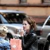 Mischa Barton enjoys a snack and a smoke with friends in the West Village New York City.