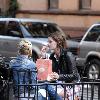 Mischa Barton enjoys a snack and a smoke with friends in the West Village New York City.