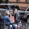 Mischa Barton enjoys a snack and a smoke with friends in the West Village New York City.