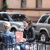 Mischa Barton enjoys a snack and a smoke with friends in the West Village New York City.