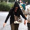 Nikki Reed tries to hide her face from photographers cameras whilst walking back to her hotel after having dinner and shopping on Robson Street.