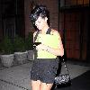 Rihanna 
leaves her Soho hotel holding a green folder.