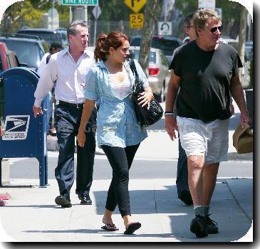 Ryan O'Neal takes food to go after having lunch with a friend.