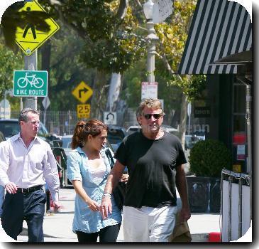 Ryan O'Neal takes food to go after having lunch with a friend.