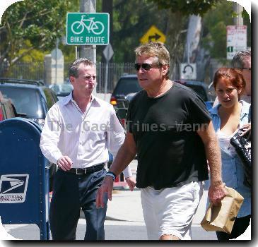 Ryan O'Neal takes food to go after having lunch with a friend.