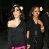 Amy Winehouse and her goddaughter Dionne Bromfieldholding hands as they walk along the street, after having meal at a restaurant. She earlier presented an award to The Specials at the Q Awards at Grosvenor House. London.