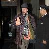 David Arquette attempts to avoid fans and photographers while leaving his hotel in Midtown New York City.