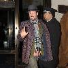 David Arquette attempts to avoid fans and photographers while leaving his hotel in Midtown New York City.