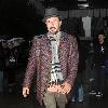 David Arquette attempts to avoid fans and photographers while leaving his hotel in Midtown New York City.