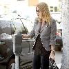 Nicky Hilton putting money in a parking meter while out and about in Beverly Hills Los Angeles.