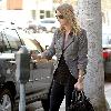Nicky Hilton putting money in a parking meter while out and about in Beverly Hills Los Angeles.