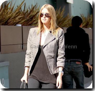 Nicky Hilton putting money in a parking meter while out and about in Beverly Hills Los Angeles.