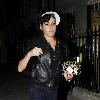 Singer Amy Winehouse smokes a cigarette after leaving the Fish Works Restaurant in Marylebone. London.