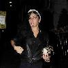 Singer Amy Winehouse smokes a cigarette after leaving the Fish Works Restaurant in Marylebone. London.