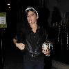 Singer Amy Winehouse smokes a cigarette after leaving the Fish Works Restaurant in Marylebone. London.