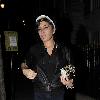 Singer Amy Winehouse smokes a cigarette after leaving the Fish Works Restaurant in Marylebone. London.