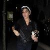 Singer Amy Winehouse smokes a cigarette after leaving the Fish Works Restaurant in Marylebone. London.