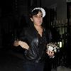 Singer Amy Winehouse smokes a cigarette after leaving the Fish Works Restaurant in Marylebone. London.